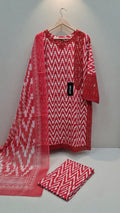 Red and white patterned kurta with matching dupatta on a hanger against a white background