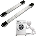 Two metal slides with black ends on a white background, with a washing machine and cartoon character below.