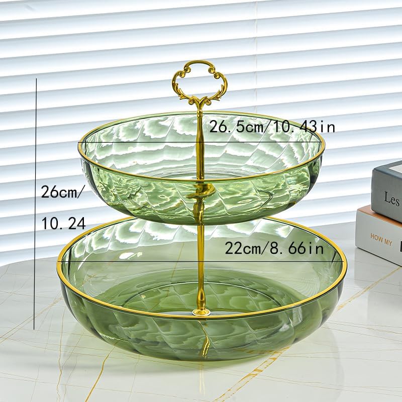 Two-tiered glass fruit basket with gold accents and measurements on a white surface.