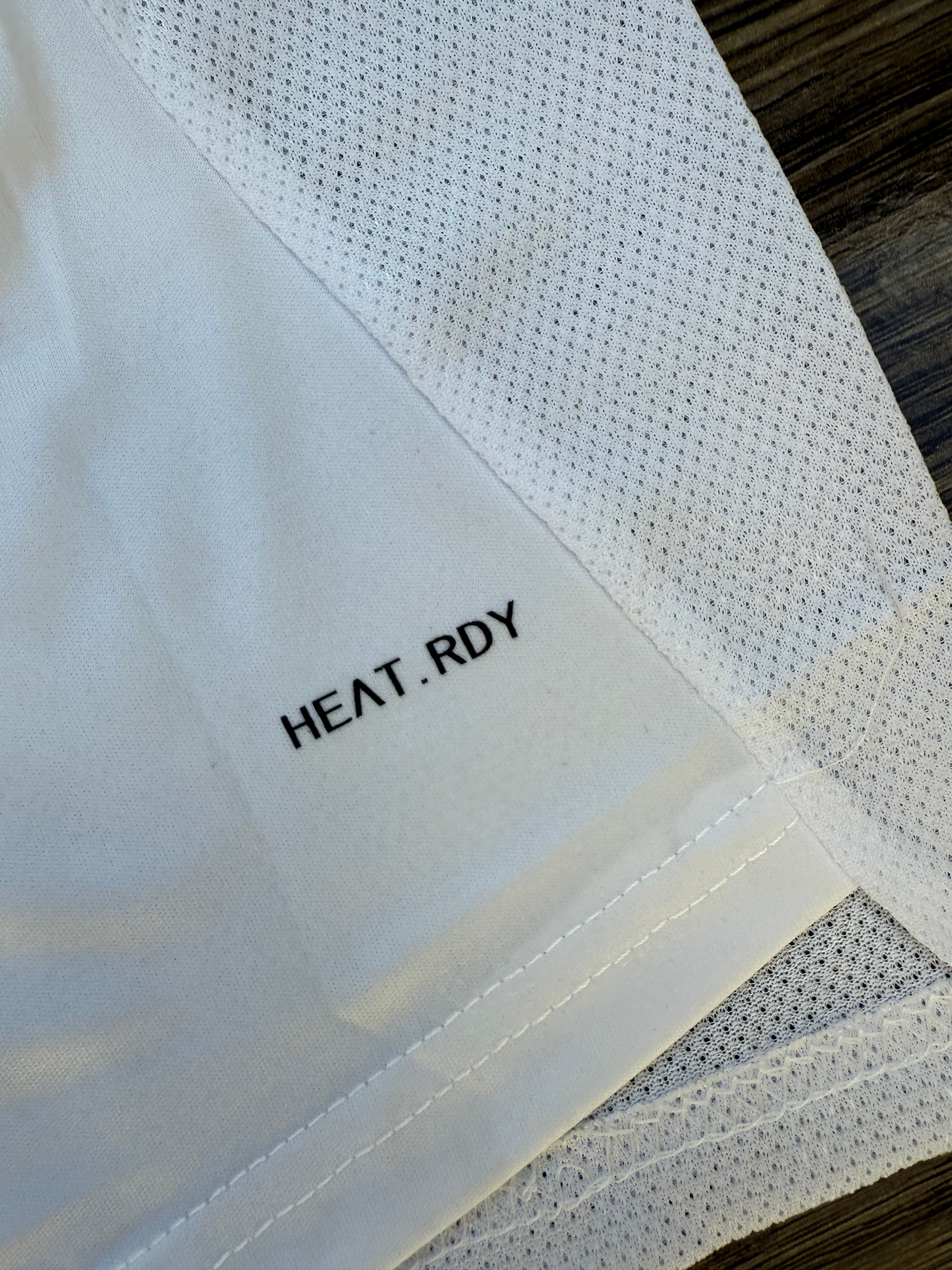 Text 'HEAT.RDY' on a textured white surface