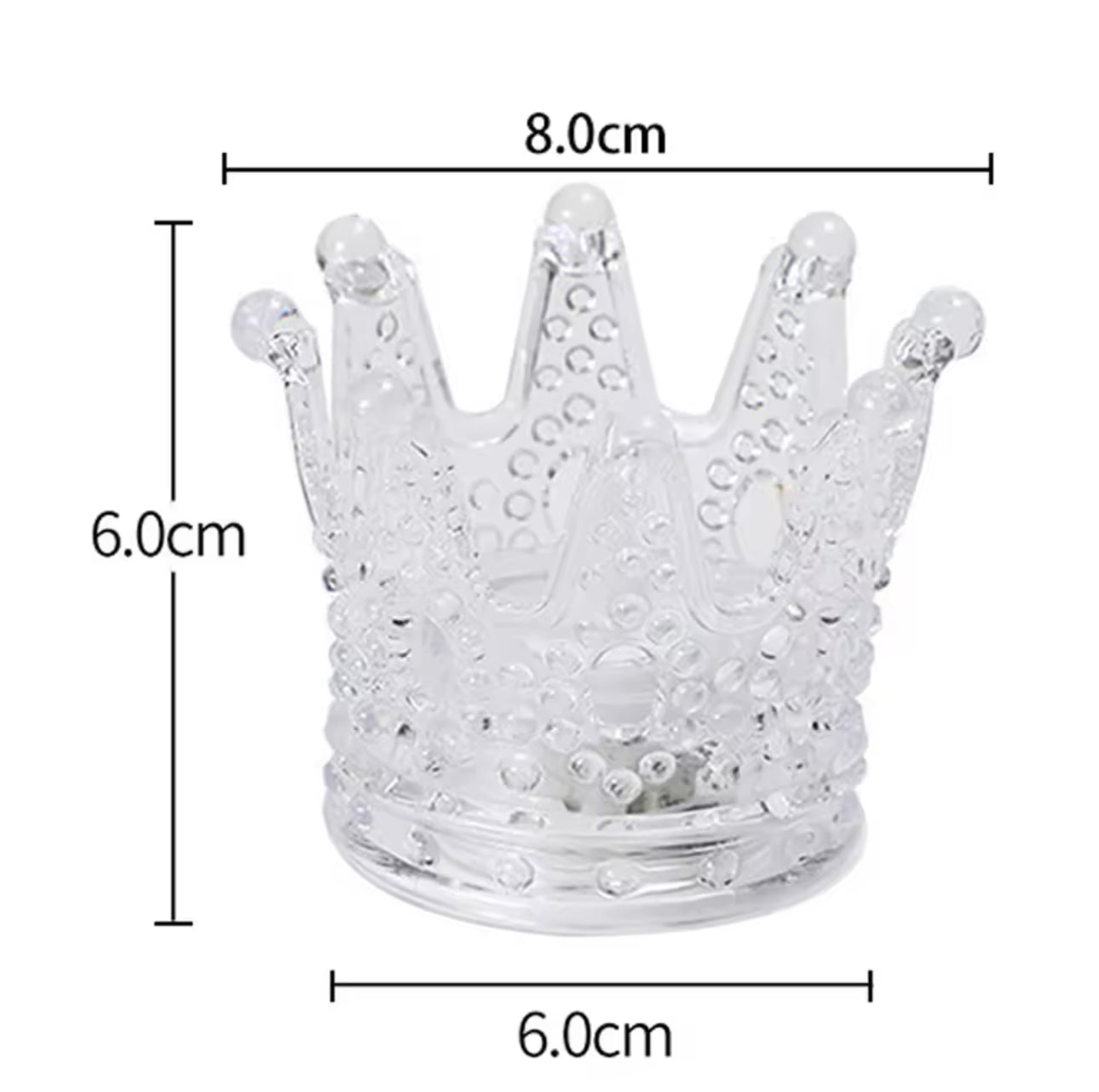 Clear glass crown-shaped object with measurements on a white background