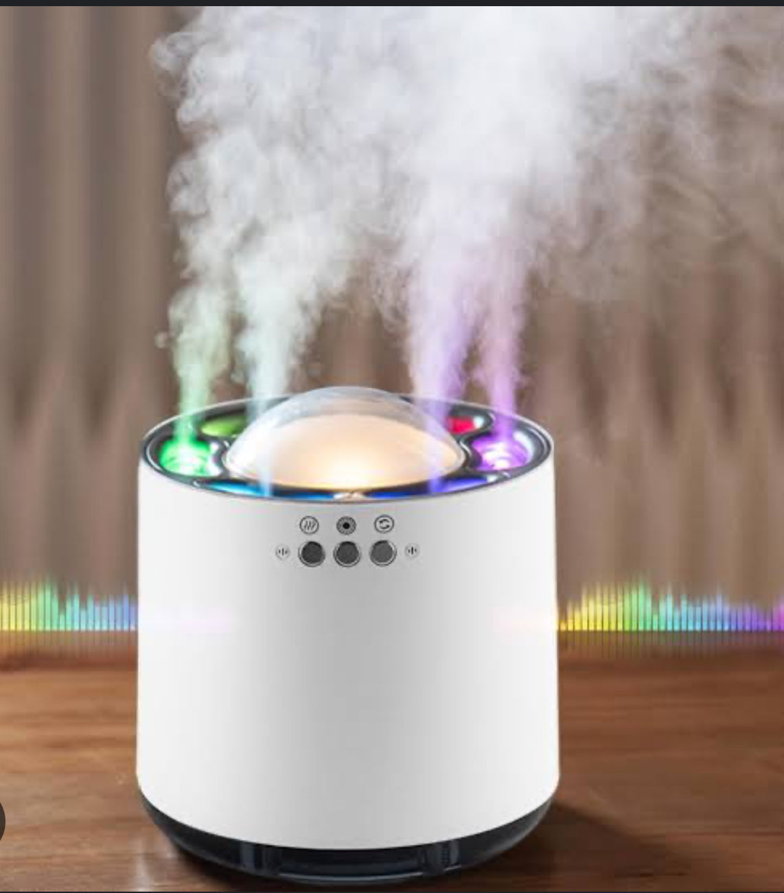 White humidifier emitting steam with colorful lights on a wooden surface