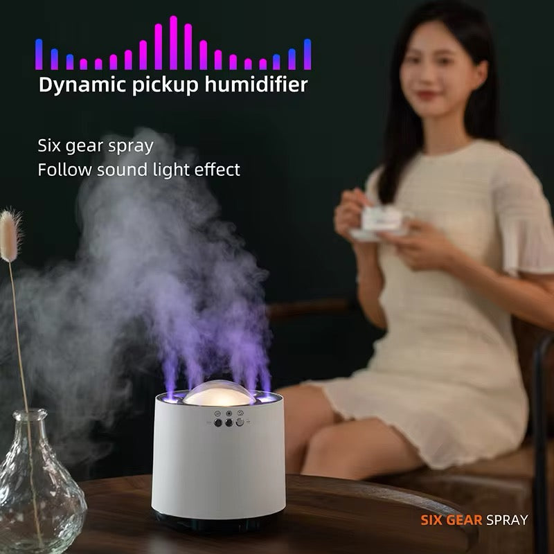 Humidifier with sound light effect on a table, woman sitting in the background