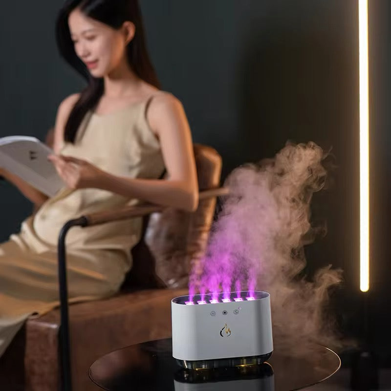 Woman reading a book with a humidifier emitting steam in a dimly lit room.