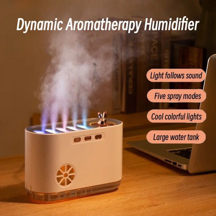 Dynamic Aromatherapy Humidifier emitting steam on a wooden surface with text highlighting features.