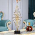 Top view flat lay of luxury home decor items on a light marble surface with ceramic vase, linen cloth, candle, wooden tray,