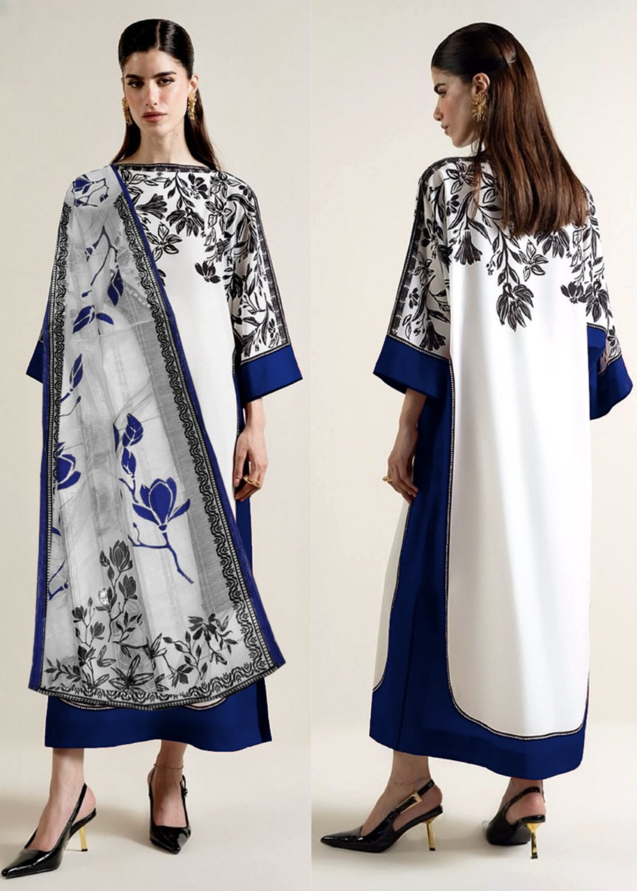 Woman wearing a white kurta with blue and black floral patterns, paired with a matching dupatta.
