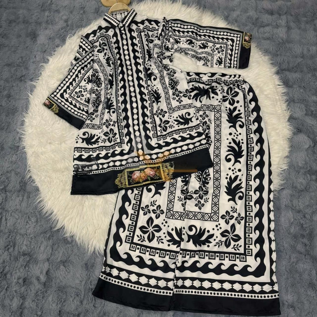 Black and white patterned fabric on a textured surface