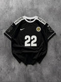 Black sports jersey with number 22 and 'Racing' text on a gray background