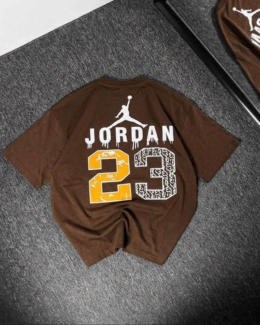 Brown t-shirt with 'Jordan 23' print on a gray surface