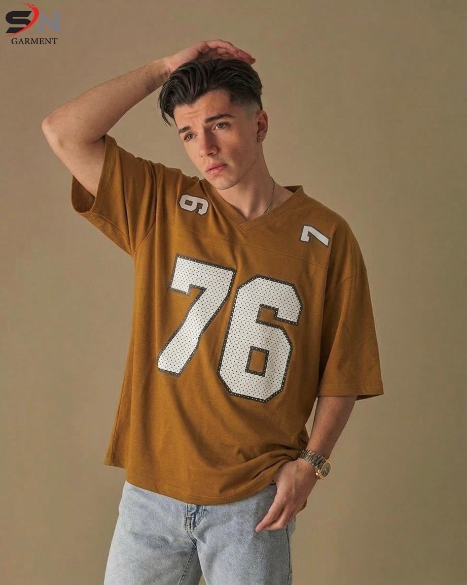 Man wearing a brown jersey with the number 76 against a beige background