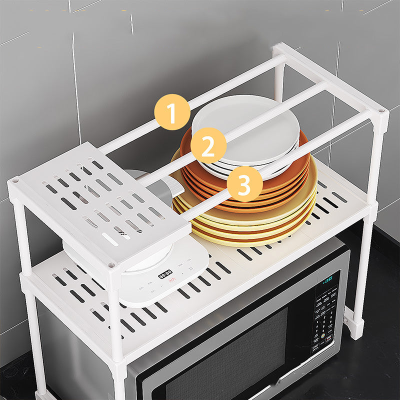White kitchen shelf with plates and a microwave in the background