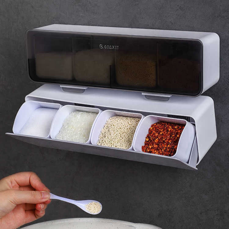 Spice rack with compartments containing different spices on a dark background