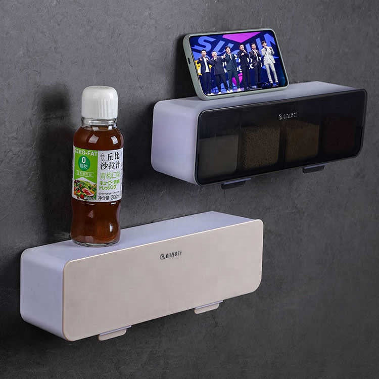 Wall-mounted shelf with a bottle and smartphone on a dark gray wall