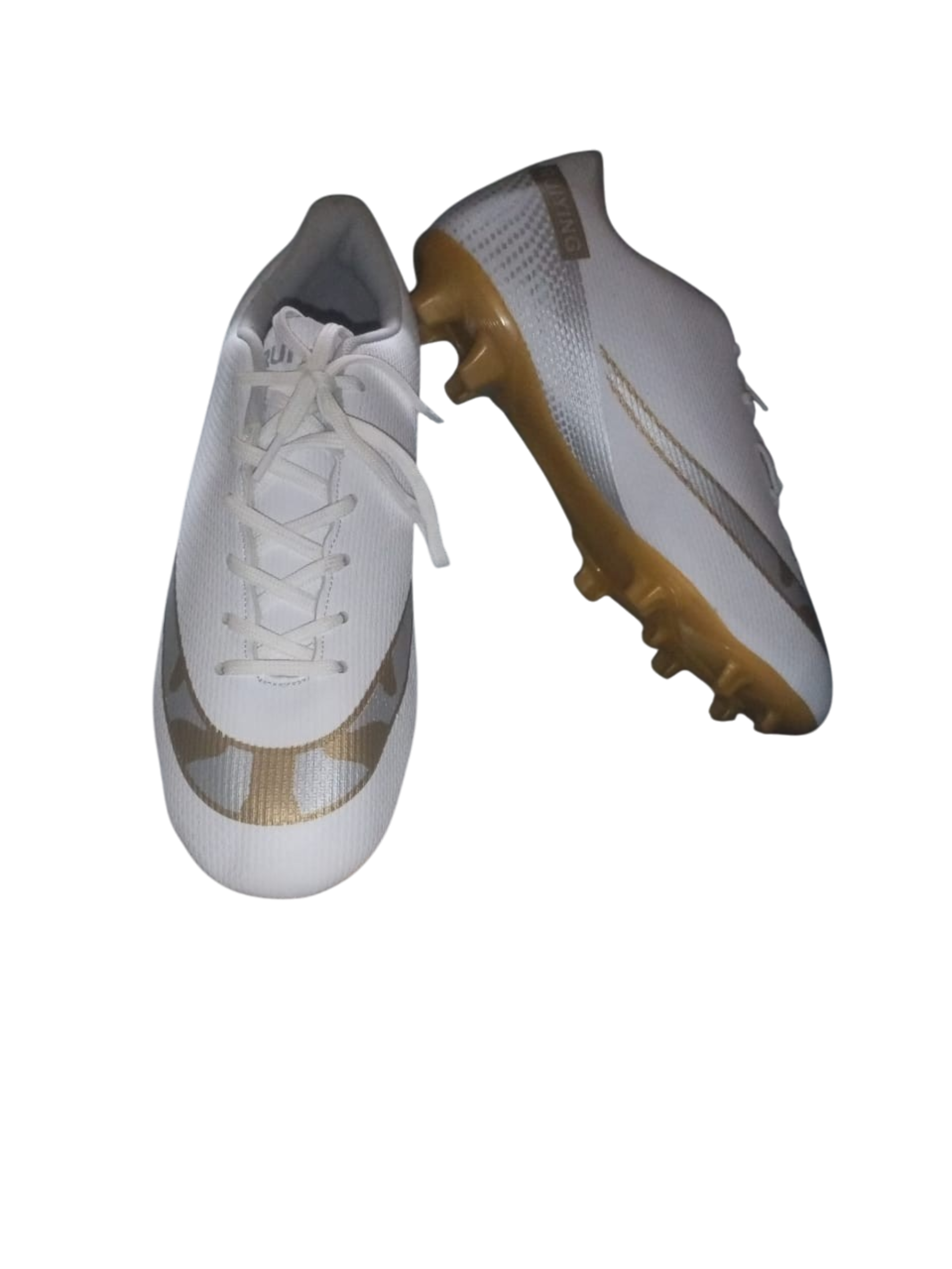 White soccer cleats with brown soles on a white background