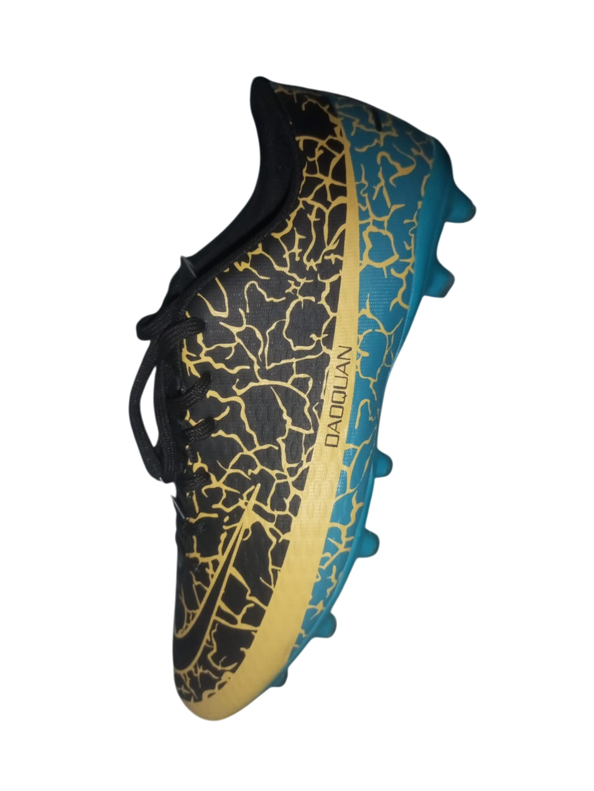 Sole of a soccer cleat with black, gold, and blue design on a white background